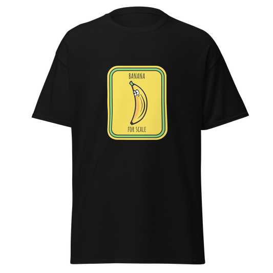 Musta unisex huumoripaita, jossa keskellä keltainen, varoituskylttiä muistuttava kuvio. Banaanissa on silmät ja tekstit "BANANA" ja "FOR SCALE". Design on koominen ja graafinen – kielletään kaikki